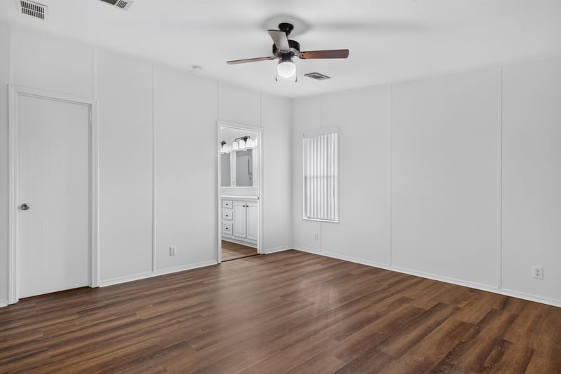 Hallway with wood flooring and doorways at 3215 Robin Ln, Middleburg, FL