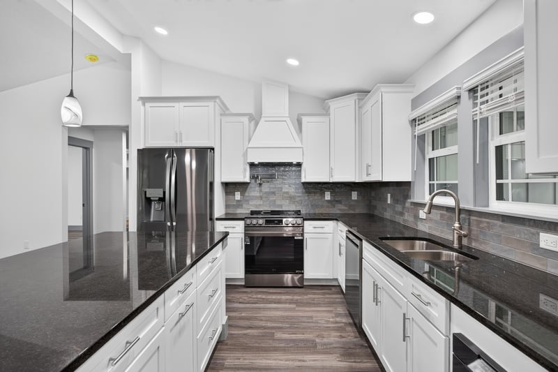 Kitchen with island, range, and tile backsplash at 4800 Acacia St, Middleburg, FL 32068