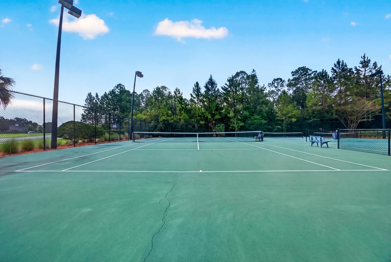 Tennis court at ground level in River Glen