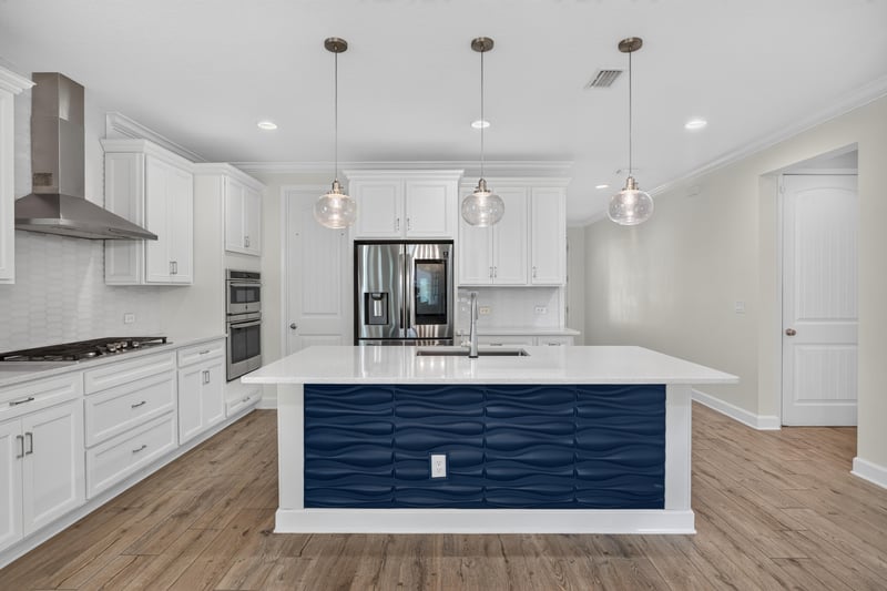 Kitchen with range hood and stainless refrigerator at 855 Flach Dr, St. Johns, FL