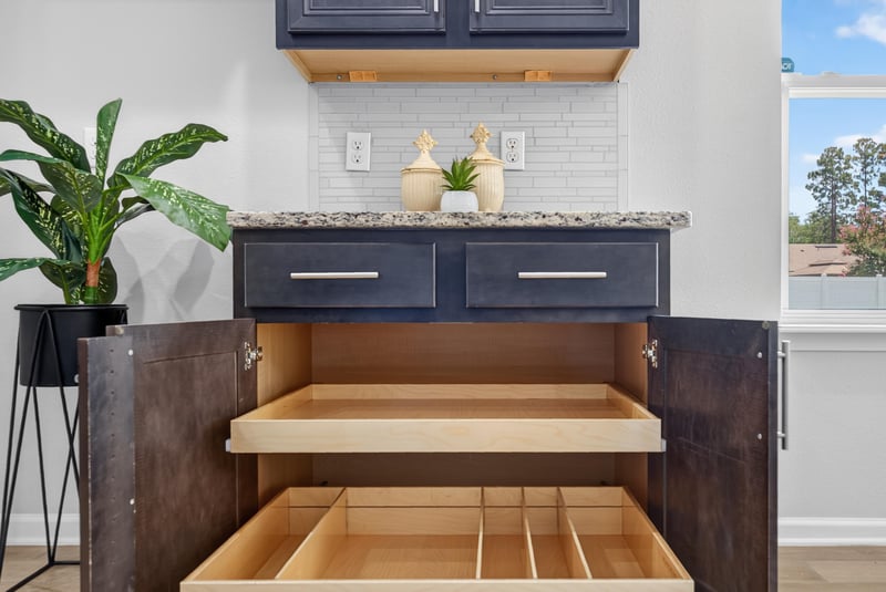 Kitchen cabinet with pull-out shelving at 10066 Andean Fox Dr, Jacksonville, FL 32222