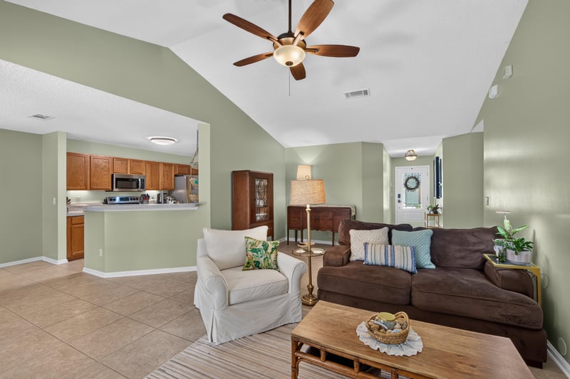 Living room open to kitchen at 1589 Backwater Drive, Middleburg, FL 32068