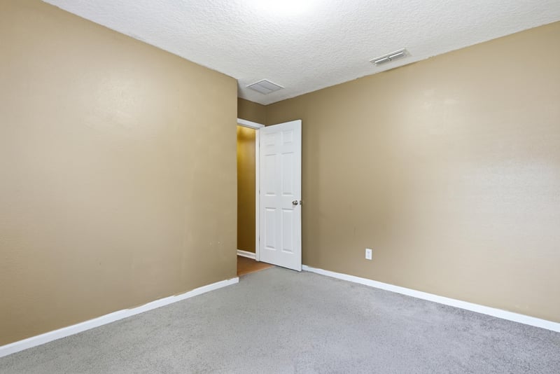 Empty room with closet door at 7392 Timber Falls Ct