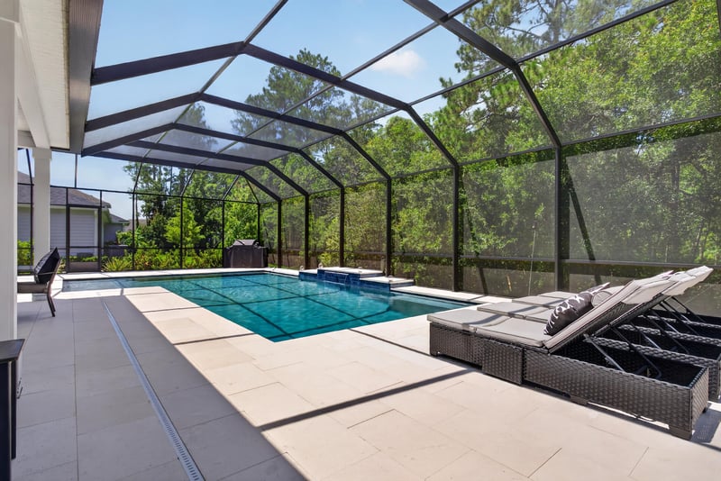 Pool with loungers on the paver deck at 785 Back Creek Dr, St. Augustine, FL 32092