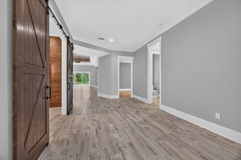Entry hallway with wood doors leading to the great room at 186 Freshwater Dr