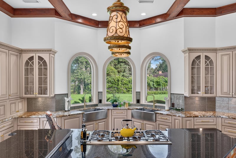 Kitchen with arched windows and water view at 344 Broward Rd, Jacksonville, FL