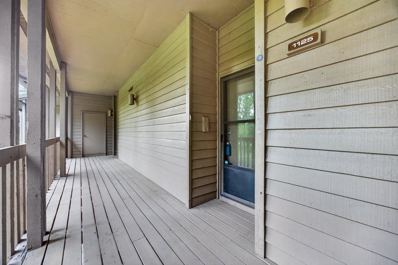 Covered walkway leading to the front door at 2910 Ravines Rd, Middleburg, FL 32068