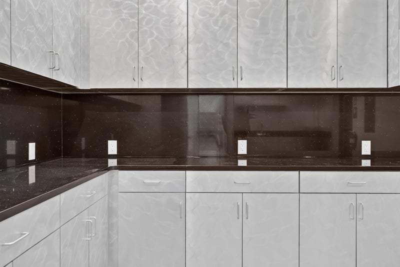 Close view of kitchen cabinets and dark countertop at 7240 Golden Wings Rd building 100, Jacksonville, FL 32244