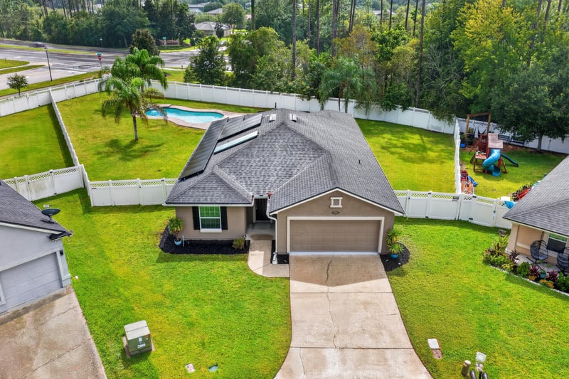 Aerial view of home and backyard pool at 706 Grampian Highlands Dr, St. Johns, FL 32259