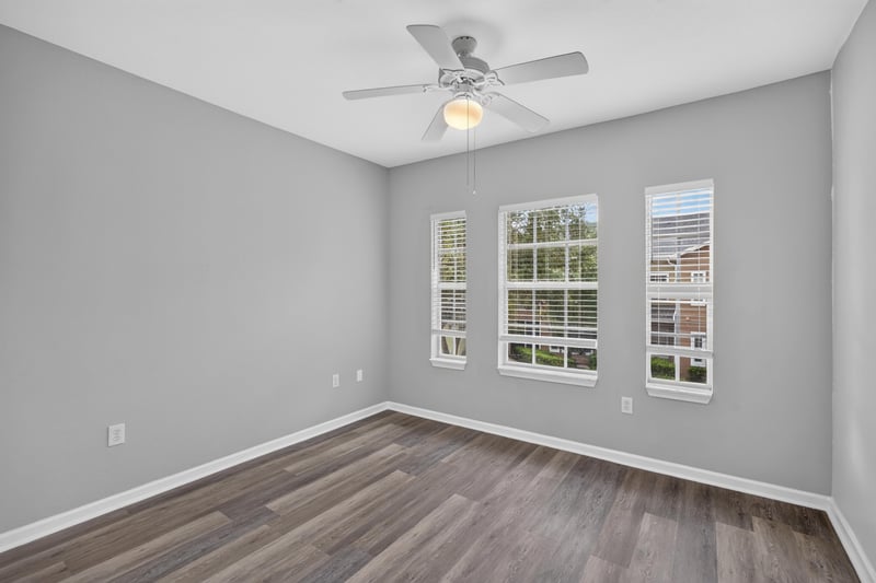 Empty bedroom with windows and hardwood floors at 10075 Gate Pkwy unit 1905, Jacksonville, FL 32246