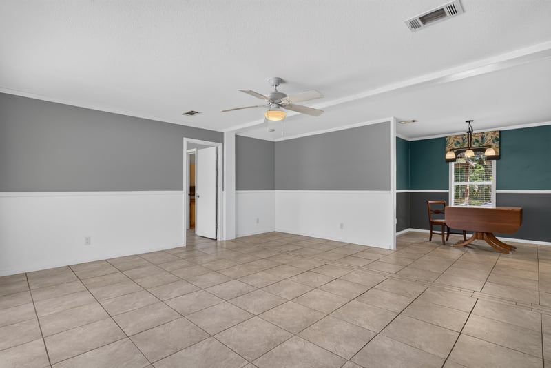 Open living and dining space with tile floor at 2549 Snapdragon Ave, Middleburg, FL 32068