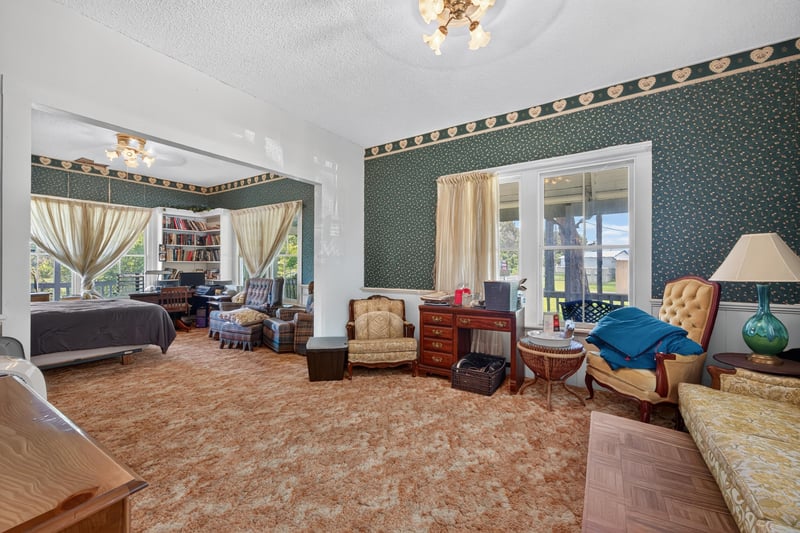 Bedroom with carpet and sitting furniture at 1173 US-17, Satsuma, FL 32189