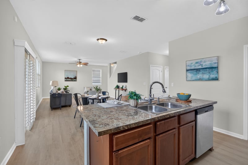 Kitchen sink area open to the living room at 6830 Hanford St, Jacksonville, FL 32219