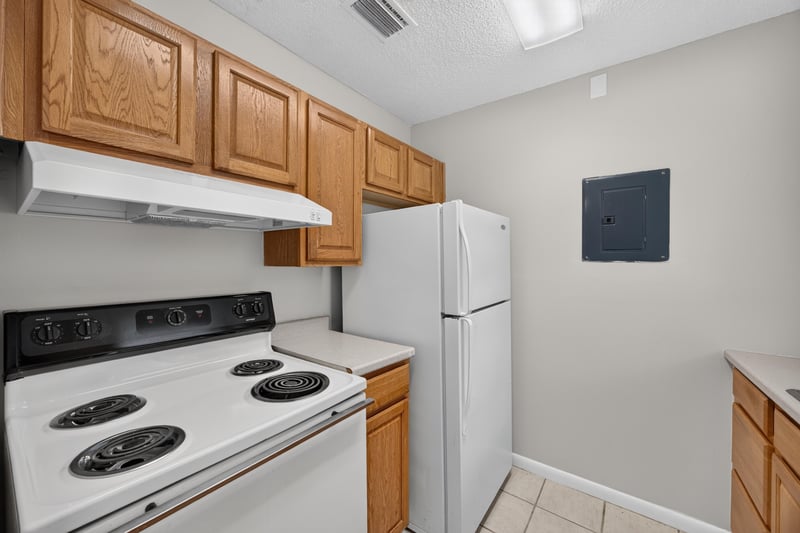 Kitchen with white refrigerator and electric range at 2717 Trollie Ln, Jacksonville, FL