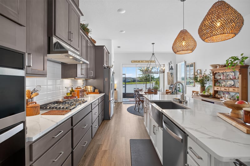 Kitchen range and hood with pendant lighting at 129 Amberwood Dr, St. Augustine, FL