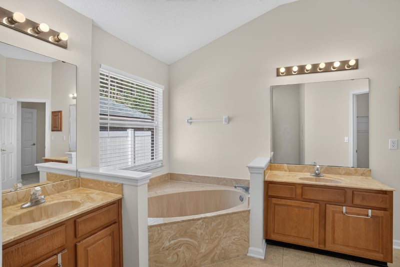 Primary bathroom vanity and window at 299 John's Creek Pkwy, St. Augustine, FL 32092