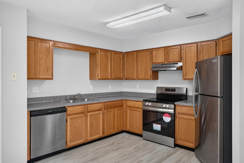 Kitchen with wood cabinets and stainless appliances at 8519 Blazing Star Ct, Jacksonville, FL 32210