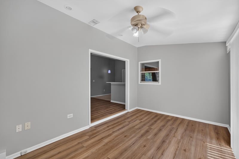 Hallway with wood floor and ceiling fan at 9256 Dale View Ln W, Jacksonville, FL 32225