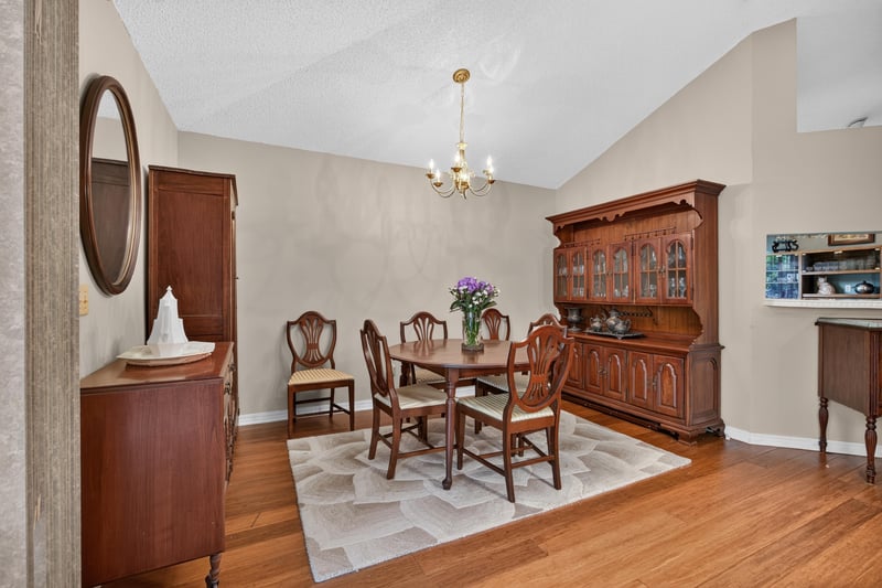 Dining room with wood table and hutch at 4837 Pareja Ct, Jacksonville, FL 32225