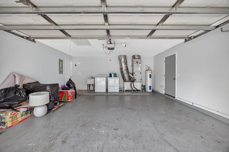 Garage interior with coffered ceiling at 8921 Needlepoint Pl, Jacksonville, FL 32244