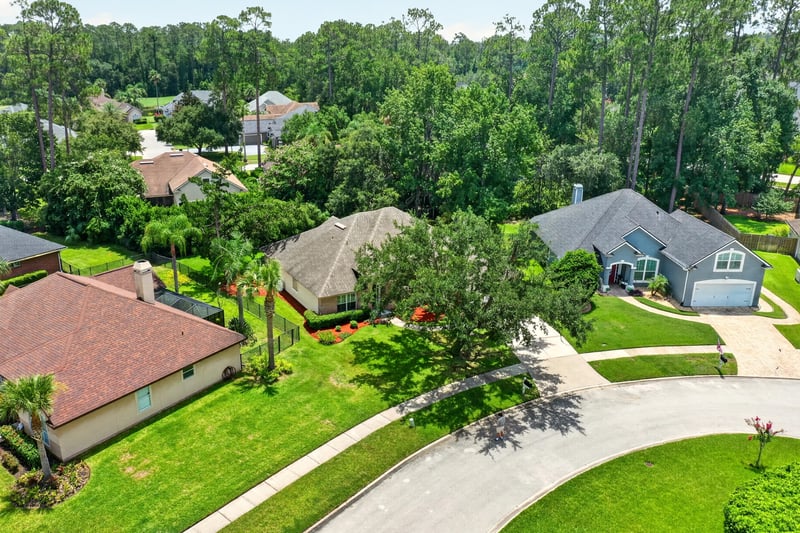 Aerial view of the home and wooded lot at 1955 GUARDED Way, Fleming Island, FL 32003