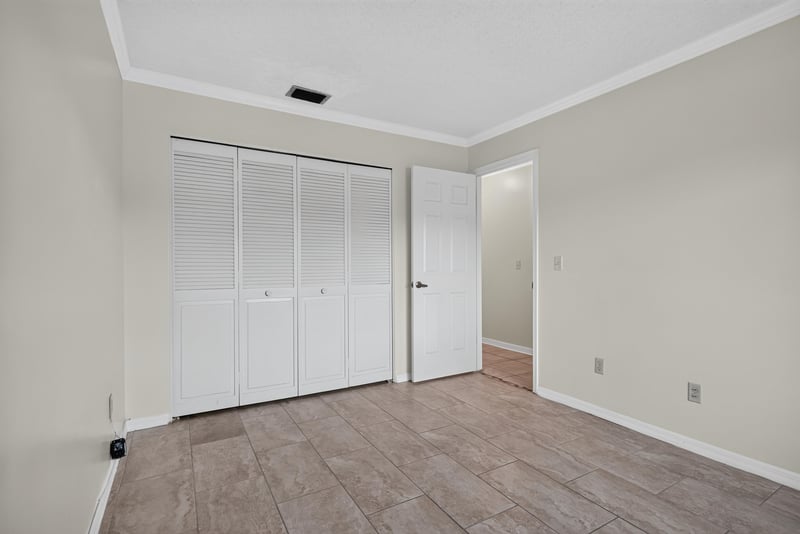 Bedroom with double closet doors at 3515 Cormorant Branch Ct, Jacksonville, FL