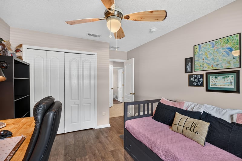 Bedroom with closet doors at 1589 Backwater Drive, Middleburg, FL 32068