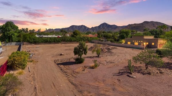 Front of an empty lot at dusk