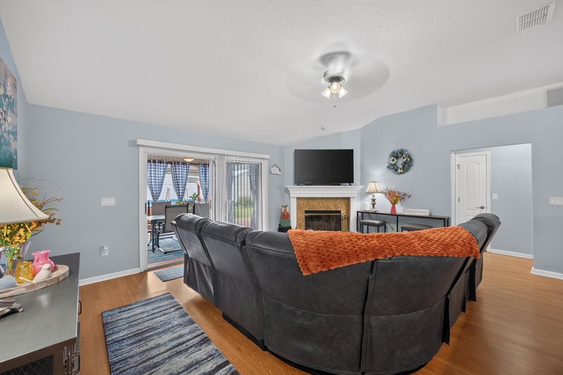 Family room seating area with area rug at 3112 Silverado Cir, Green Cove Springs, FL 32043
