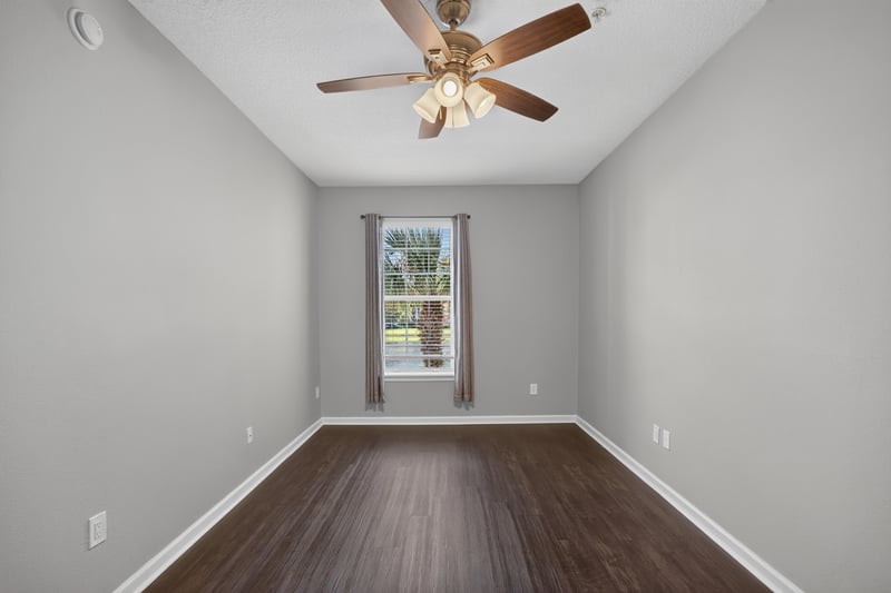 Bedroom with window and wood floors at 11251 Campfield Dr unit 4209, Jacksonville, FL 32256