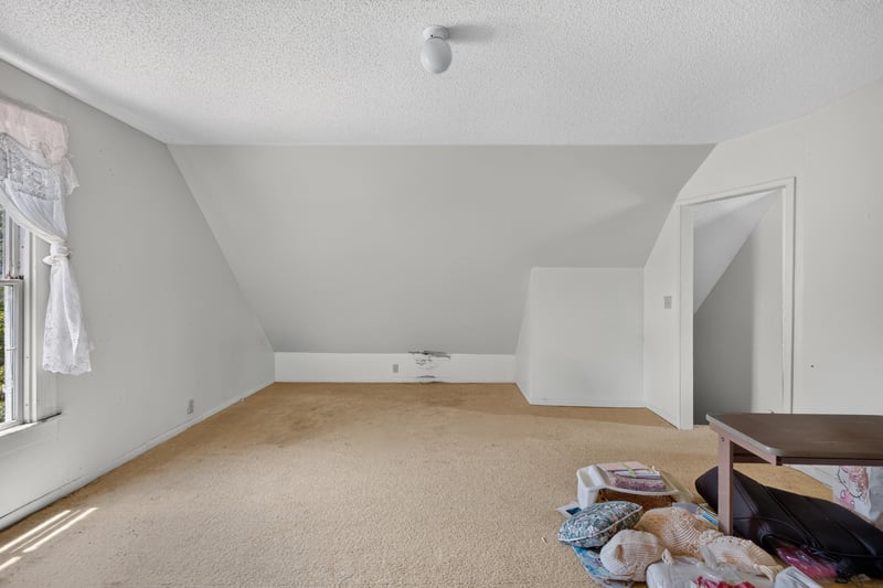 Unfurnished attic room with sloped ceiling at 1173 US-17, Satsuma, FL 32189
