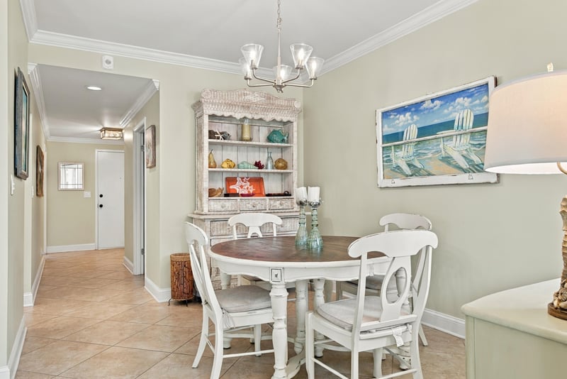 Dining nook with hutch and ocean art at 805 Spinnakers Reach Dr, Ponte Vedra Beach, FL 32082