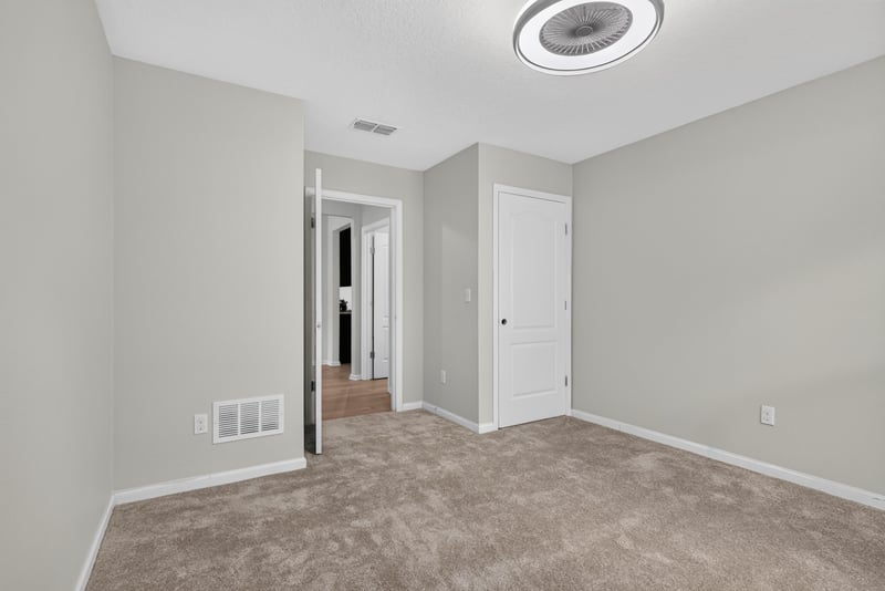 Hallway with carpet flooring leading to bedrooms at 10066 Andean Fox Dr, Jacksonville, FL 32222