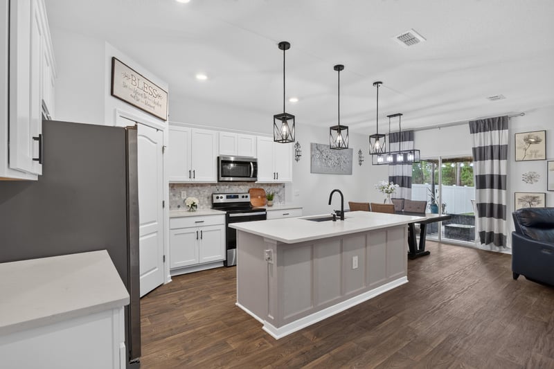 Kitchen island open to living room at 65255 Frst Glen Ln, Yulee, FL 32097
