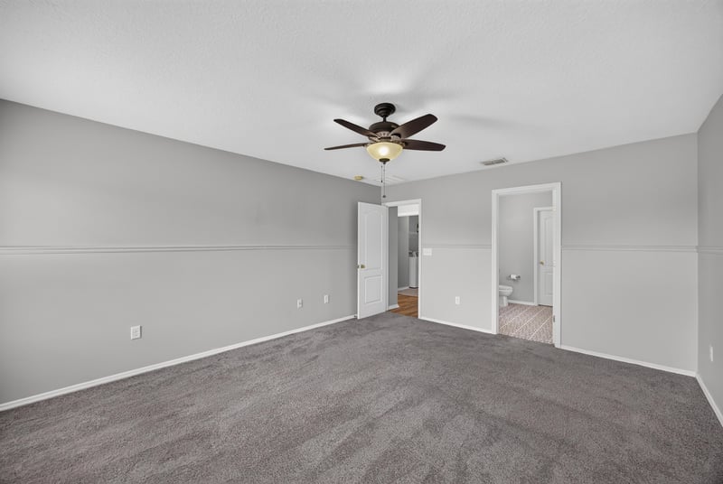 Empty room with carpet and ceiling fan at 7545 Lirope St, Jacksonville, FL 32244