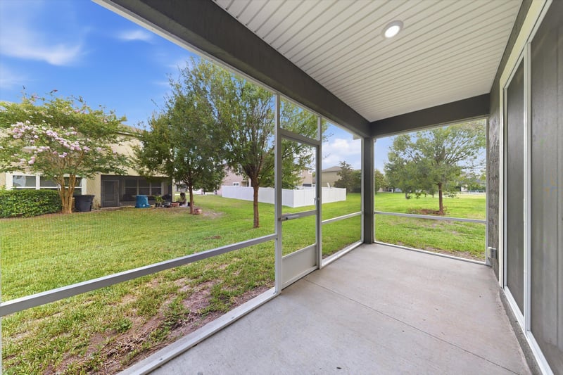 Screened porch overlooking the backyard at 2378 Caney Oaks Dr, Jacksonville, FL