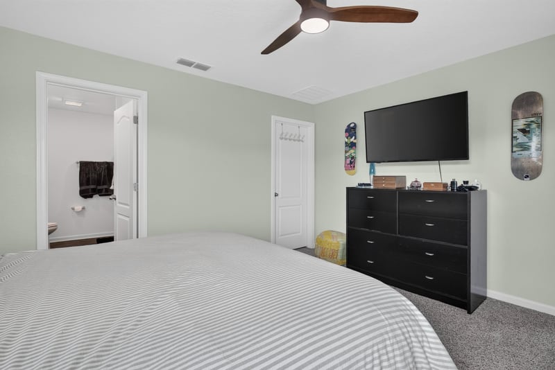 Bedroom with dresser and television at 4276 Quaking St, Jacksonville, FL 32218