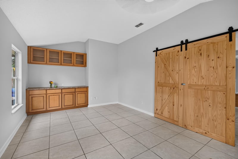 Bonus room with sliding barn doors and built-ins at 456 Bay Point Way N, Jacksonville, FL 32259