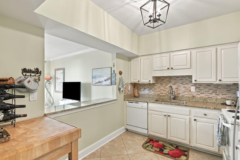 Kitchen desk nook with wall-mounted TV at 805 Spinnakers Reach Dr, Ponte Vedra Beach, FL 32082