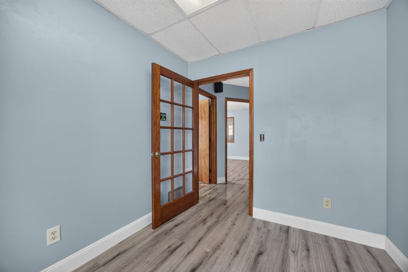 Room with open French doors and wood-look floor at 1543 Kingsley Ave #19, Orange Park, FL 32073