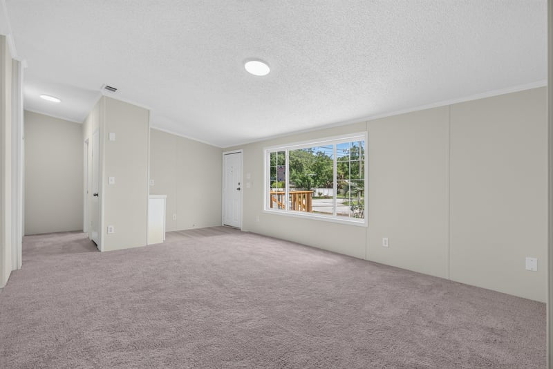 Living room with window, unfurnished at 7603 Coach Park Dr, Jacksonville, FL 32244