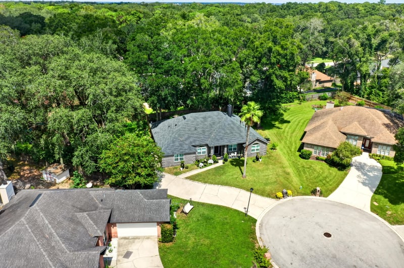 Aerial view of the home among mature oak trees at 1346 Gately Ct, Jacksonville, FL 32225