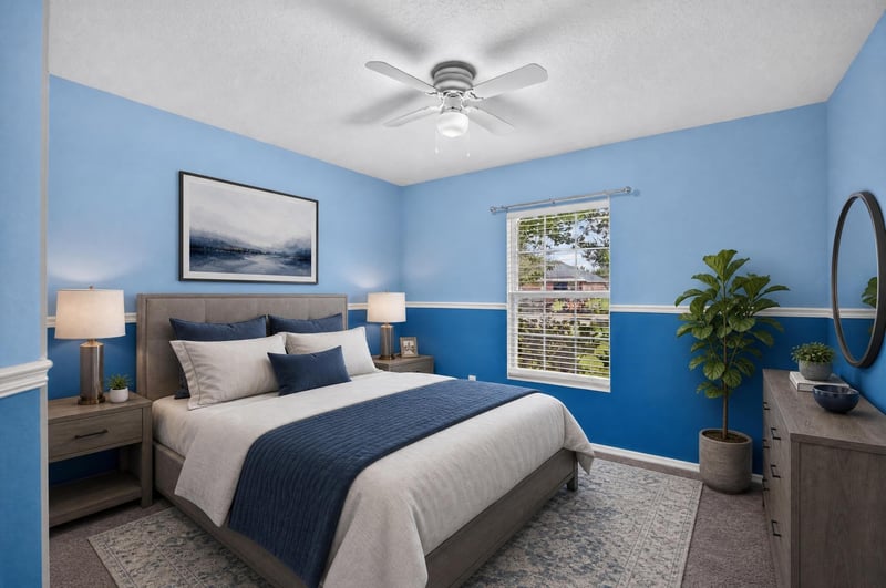 Staged bedroom with blue accent walls at 7545 Lirope St, Jacksonville, FL 32244