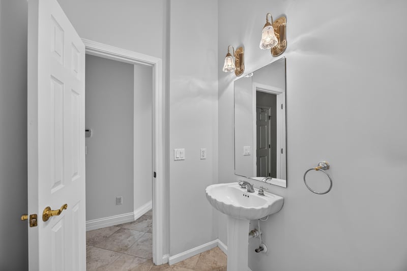 Bathroom vanity with sconce lighting at 11675 Magnolia Estates Rd, Jacksonville, FL 32223