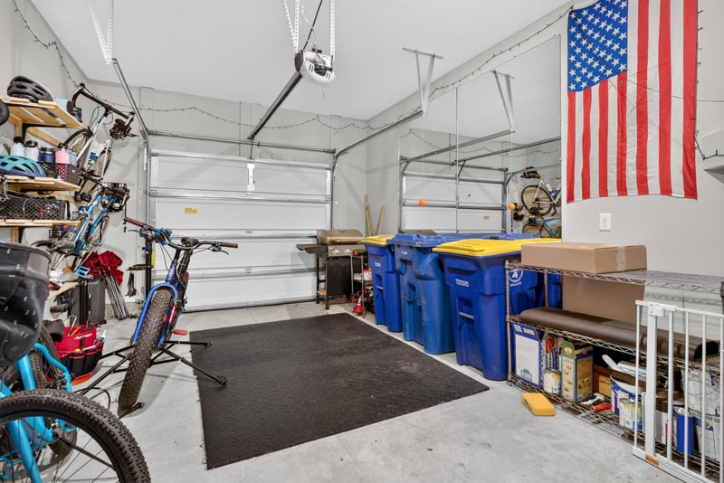 Garage with bikes and storage bins at 1186 Beach Dune Dr, Jacksonville, FL 32233