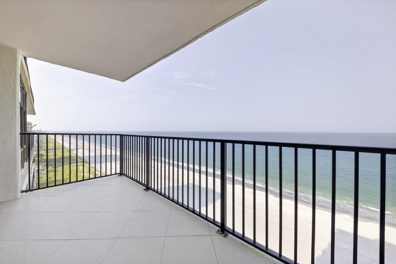 Balcony railing with view down the beach at 1301 1st St S
