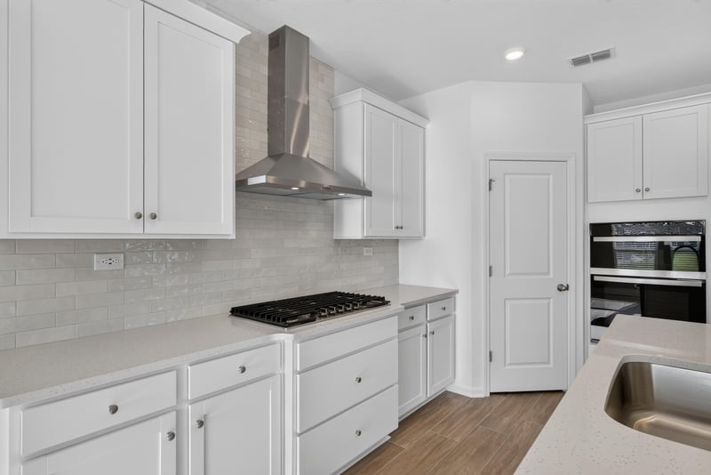 Kitchen cooktop and tile backsplash at 269 Bluegrass Wy, St. Augustine, FL 32092