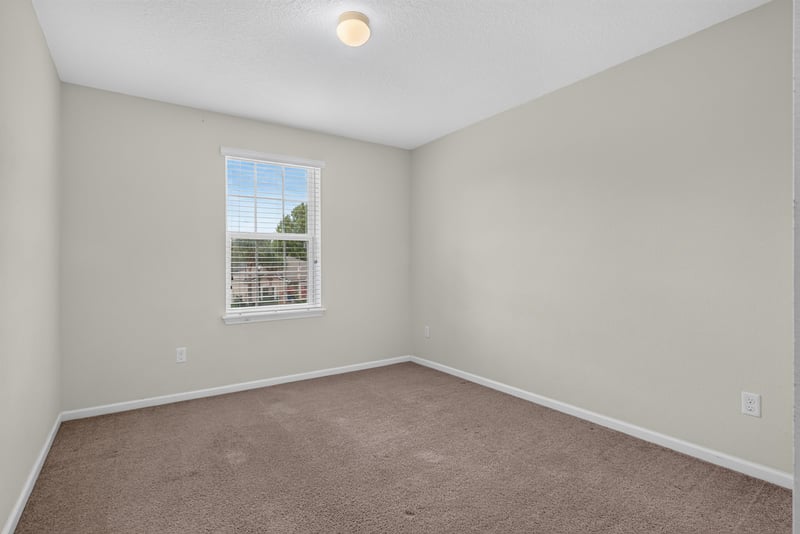 Bedroom with carpet and window at 263 Gilmore Ln, Orange Park, FL 32065