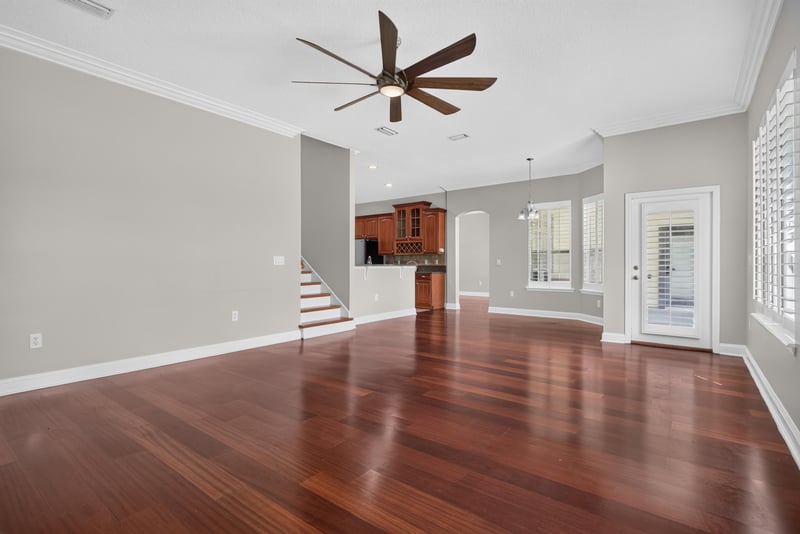 Family room with staircase visible beyond at 4109 Eagle Landing Pkwy, Orange Park, FL 32065