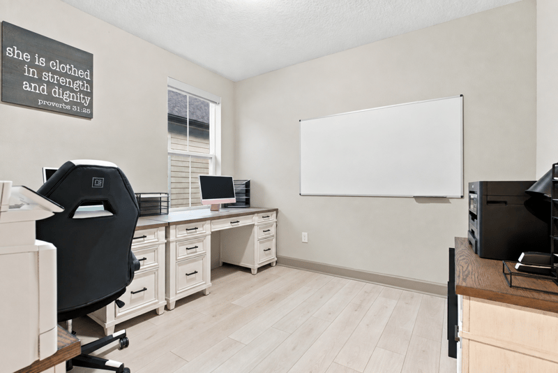 Home office with desk, monitor and wall graphic at 3921 Spyglass Hill Ln